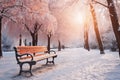 Park bench and trees covered by heavy snow. Lots of snow. Sunset Royalty Free Stock Photo