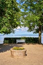 Park bench under trees in the public park on Lake Schwerin