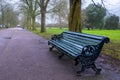 Park bench on the walking path Royalty Free Stock Photo