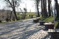 park benches and ancient cobblestone road Royalty Free Stock Photo