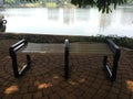 The park benches around the lake in the campus area Royalty Free Stock Photo