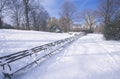 Park benches with snow in Central Park, Manhattan, New York City, NY after winter snowstorm Royalty Free Stock Photo