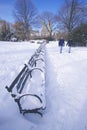 Park Benches with snow in Central Park, Manhattan, New York City, NY after winter snowstorm