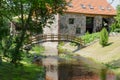 Park with bridge over stream ancient brick manor Royalty Free Stock Photo