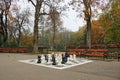 Park with chess figures autumn Royalty Free Stock Photo