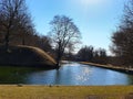 Park in the city water reflection blue sky in lake green grass tree ducks swim in the lake Old Town Of Tallinn Estonia Royalty Free Stock Photo