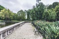 Park with empty benches with view of duck pond and trees around. Royalty Free Stock Photo