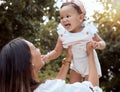 Park, family and mom holding baby in air enjoying nature, outdoors and sunshine. Affection, love and mother lifting cute Royalty Free Stock Photo