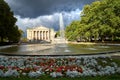 park with a fountain, flower beds and the facade of the historic opera house park with a fountain, flower beds and the facade of Royalty Free Stock Photo