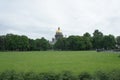 Park in front of famous Isaac cathedral in Saint Petersburg, Russia. Natural lawn showing a wide field of green grass, with trees