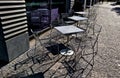 Park furniture chess table and chairs, stripes, tiles four persons made of light Royalty Free Stock Photo