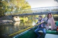 In the park, a girl with her mother is sailing on a boat Royalty Free Stock Photo