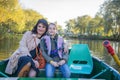 In the park, a girl with her mother is sailing on a boat Royalty Free Stock Photo