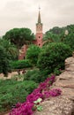 Park Guell Antonio Gaudi with flowering pink bushes. Barcelona, Spain Royalty Free Stock Photo