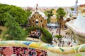 Park Guelle detail of mosaics on the benchs and cityscape of Barcelona on the background, Catalonia, Spain