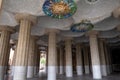 PARK GUELL, BARCELONA, CATALONIA: the Hypostyle Hall with stone colummns and iconic trencadis mosaic ceiling