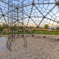 Park and homes seen from inside a dome climber