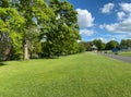 Park landscape, with a distant Victorian bandstand in, Lister Park, Bradford, UK