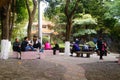 Park landscape, the men and women and the young and the young tourists play in the park