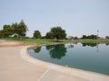 A park with a large pond and golf course Royalty Free Stock Photo