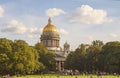 Park with a lawn, where a lot of people resting in front of St. Isaac`s Cathedral.Saint-Petersburg. Royalty Free Stock Photo