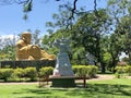 Buddhist temple in the city of Foz do Iguacu. Open patio in front of the temple with trees and golden Buddha statue