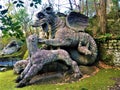 Park of Monsters, Sacred Grove, Garden of Bomarzo. Dragon with Lions and fascination Royalty Free Stock Photo