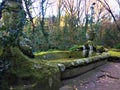 Park of the Monsters, Sacred Grove, Garden of Bomarzo. A now-dry pool in the shape of a boat, with dolphin fountain heads at both