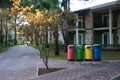 In the park near the house, there is a container for separate garbage collection with appropriate inscriptions Royalty Free Stock Photo