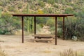 Park and outdoor awning in sabino national area in tuscon arizona with metal gazebo and cement bench for picnics Royalty Free Stock Photo