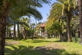 A Park with palm trees and a Villa in the subtropics Royalty Free Stock Photo