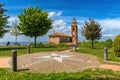 Park and parish church under beautiful sky in Italy Royalty Free Stock Photo