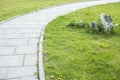 Park path and green grass. Details of city park Royalty Free Stock Photo