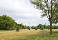 Park with a picnic bench on a sunny summer day in Toronto with a view of the CN tower Royalty Free Stock Photo