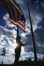 Park Ranger raising American Flag