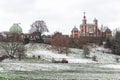 Park rangers putting fence up at Greenwich Park covered in winter snow in London