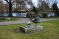 Park recreation area with decorative figures of swans near the river Spree. 12555 Berlin, Germany