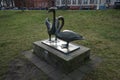 Park recreation area with decorative figures of swans near the river Spree. 12555 Berlin, Germany