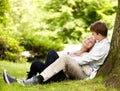 Park, relax and happy couple hug, love and cuddle in outdoor nature, green garden or grass field, pitch or lawn. Eye