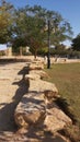 Park in Riyadh with trees and stone pavement arangements, perspetive view Royalty Free Stock Photo