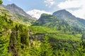 The Park Road Cuts Along the Mountain Side in Glacier National Park Royalty Free Stock Photo
