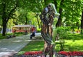 Park, sculpture of a man and a woman, old tram