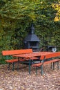 A park seat and table on a sunny autumn day Royalty Free Stock Photo