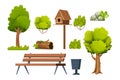 Park set of elements, wooden bench, trees, bush, stone with moss, old log, birdhouse, bin in cartoon style isolated on Royalty Free Stock Photo