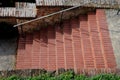 Park staircase on the terrace of an Italian garden. the stairs are made of red bricks glued to cement. forged metal railing on the Royalty Free Stock Photo