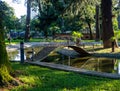 Park at sunset. Nice quiet place. Round bridge on the pond