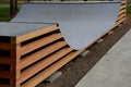 In the park there is a skateboard ramp in the shape of the letter u. Large construction of wooden beams and a metal surface. young Royalty Free Stock Photo