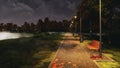 Park walkway lit by street lights at autumn night Royalty Free Stock Photo