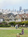 Park where people take photos of The Painted Ladies of Alamo Squareand the San Francisco city scape, California, USA