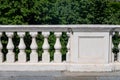 particular building with terrace on the park with white marble balustrade against the background green plants Royalty Free Stock Photo